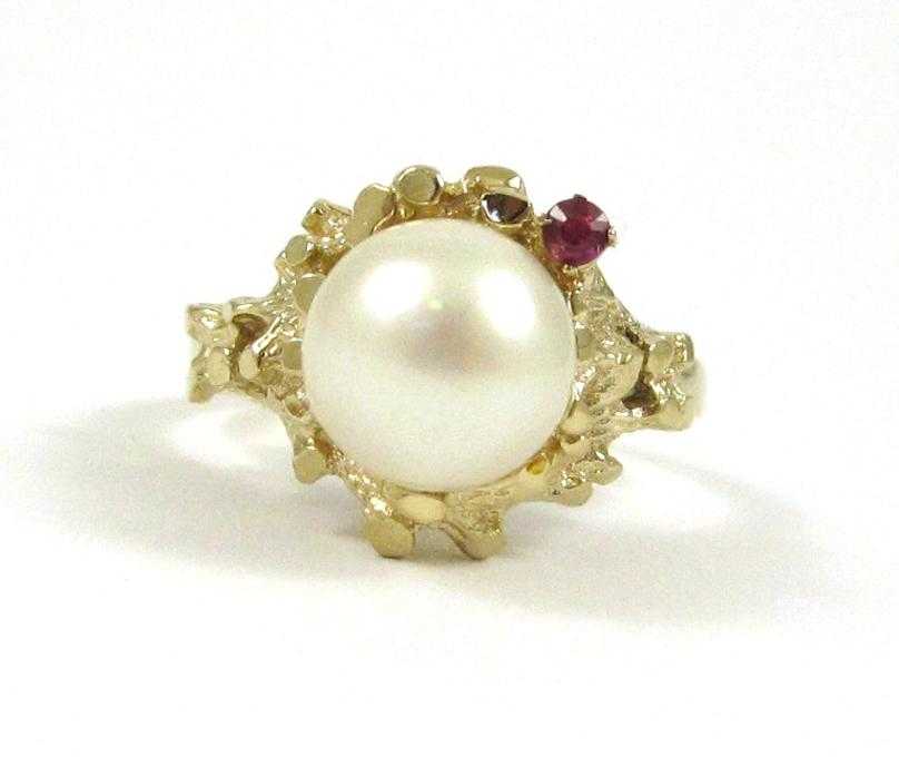 Appraisal: PEARL RUBY AND FOURTEEN KARAT GOLD RING set with a