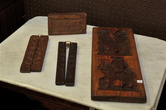 Appraisal: FOUR CARVED FOOD MOLDS American and Continental th century wood