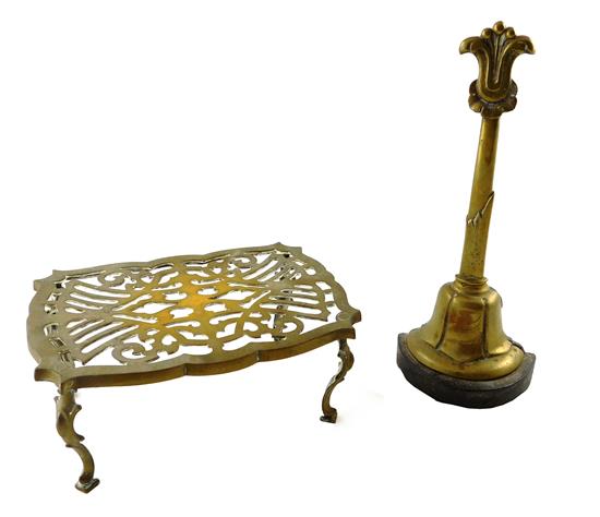 Appraisal: Brass doorstop and trivet doorstop with floral crest and demi-bell