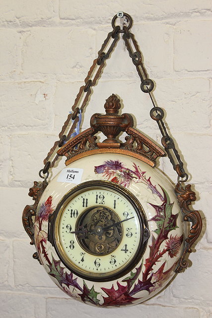 Appraisal: A FRENCH CERAMIC CASED HANGING TIMEPIECE with gilt metal mounts