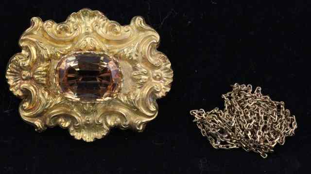 Appraisal: A citrine pendant brooch the oval stone in a rococo