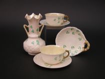 Appraisal: Belleek Shamrock Basketweave Part Tea Service Belleek tableware set includes