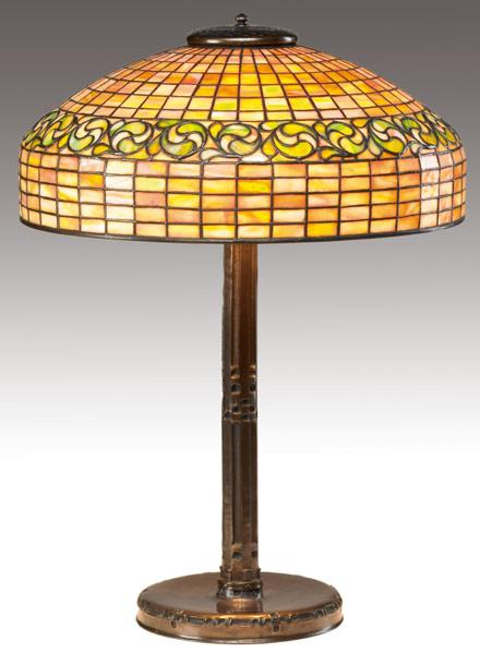 Appraisal: TIFFANY STUDIOS Table lamp with a leaded-glass shade in the