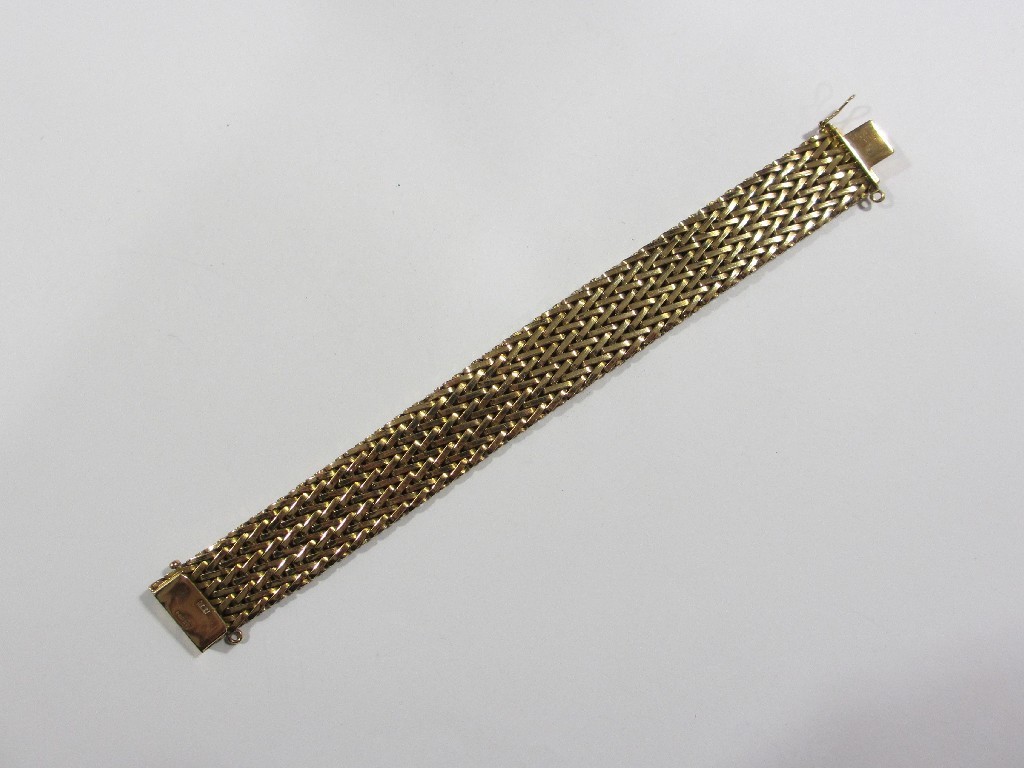 Appraisal: Nine carat gold broad weave link bracelet Approximately gms