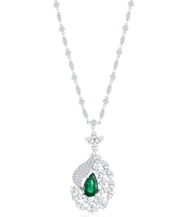 Appraisal: EMERALD AND DIAMOND PENDANT EMERALD AND DIAMOND PENDANT A deco-inspired