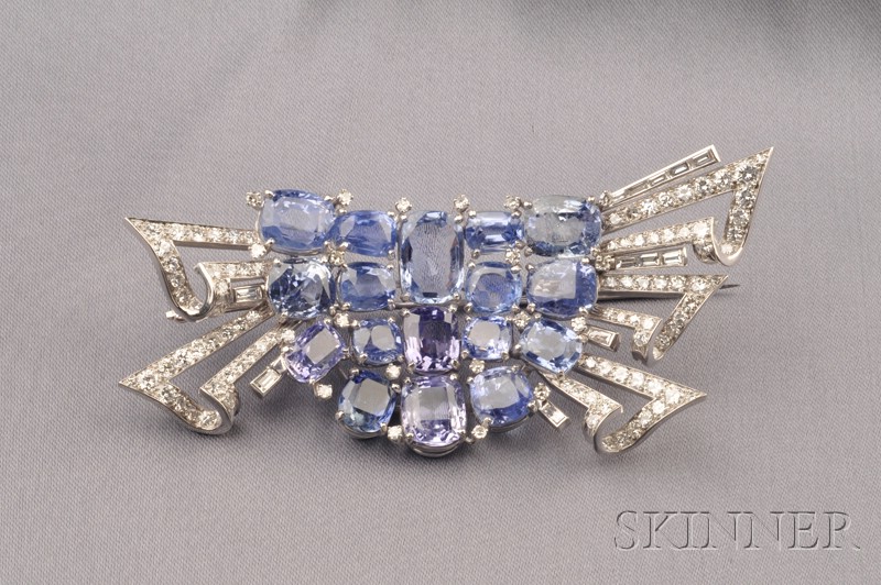 Appraisal: Platinum Sapphire and Diamond Bow Brooch centering a cluster of