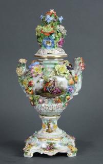 Appraisal: Dresden floral encrusted lidded porcelain urn Dresden floral encrusted lidded