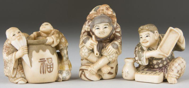 Appraisal: Three Ivory Netsukes highlighted and artist signed a man with