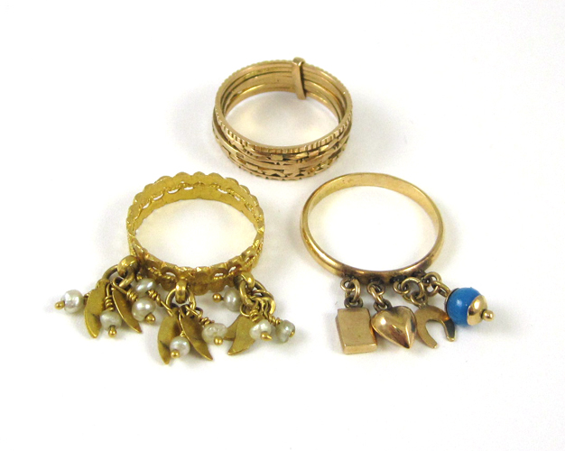 Appraisal: THREE EIGHTEEN KARAT YELLOW GOLD RINGS including a size -