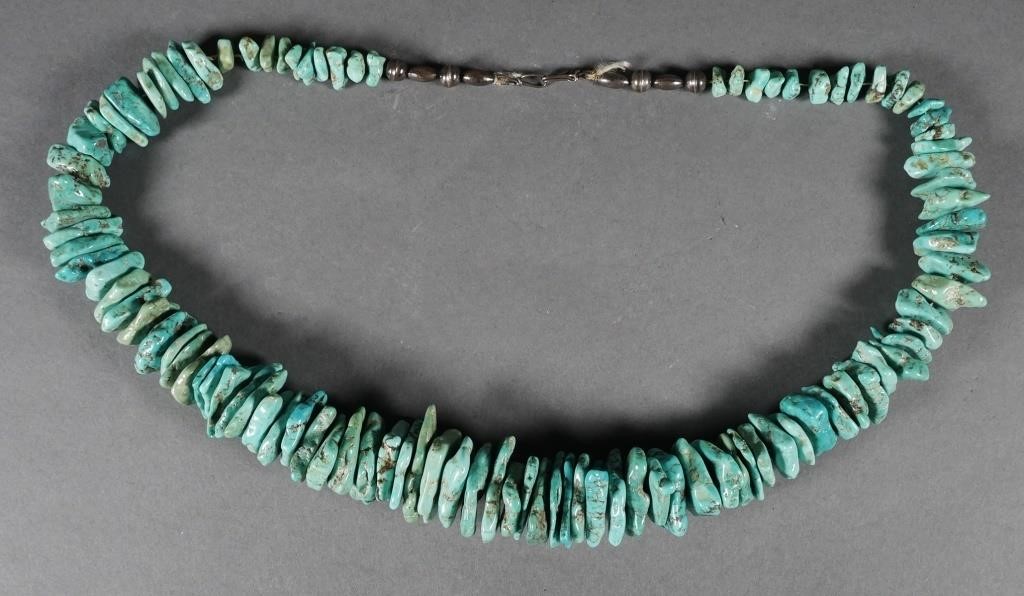 Appraisal: Freeform chunky style turquoise stone necklace Graduated stones the largest