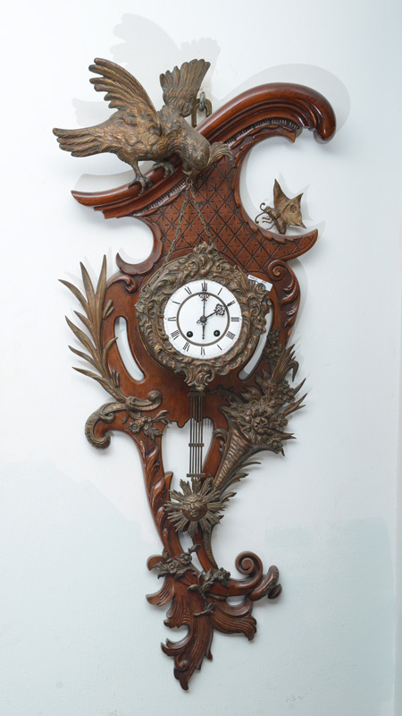 Appraisal: FRENCH BRONZE WOOD FIGURAL ROCOCO WALL CLOCK Carved and shaped