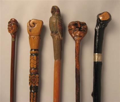 Appraisal: Group of five carved 'folk art' walking sticks th th