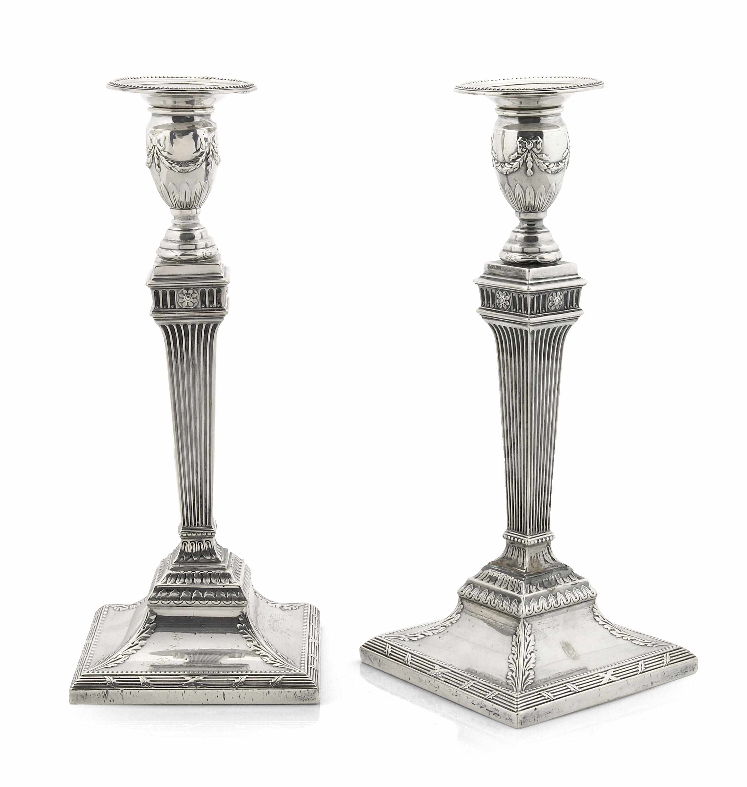 Appraisal: A sterling pair of weighted candlesticks in the George III