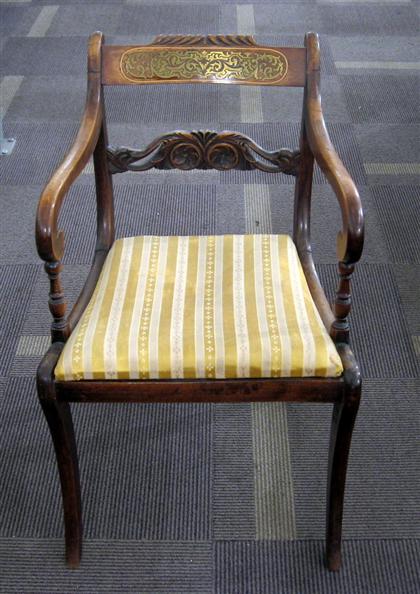 Appraisal: Regency mahogany and brass inlay armchair circa The scrolled back