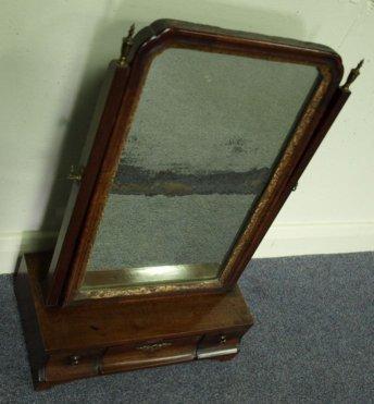 Appraisal: A George III mahogany swing frame toilet mirror with square