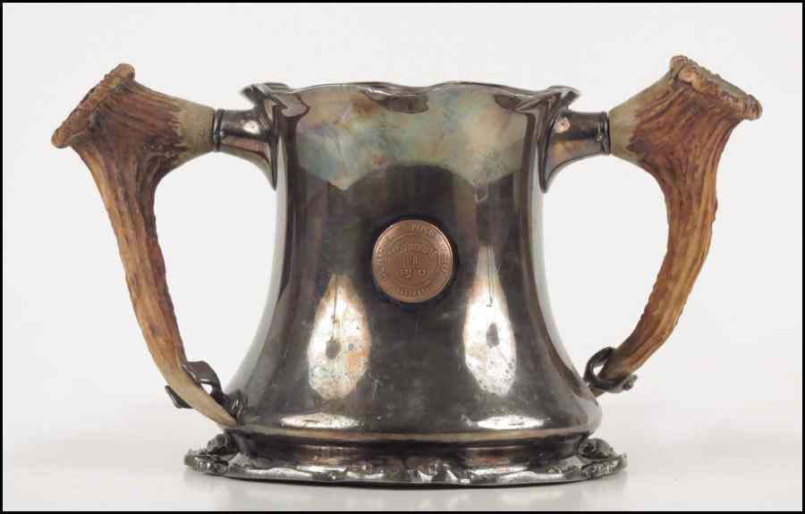 Appraisal: J E CALDWELL SILVERPLATE ANTLER HANDLED CUP With a central