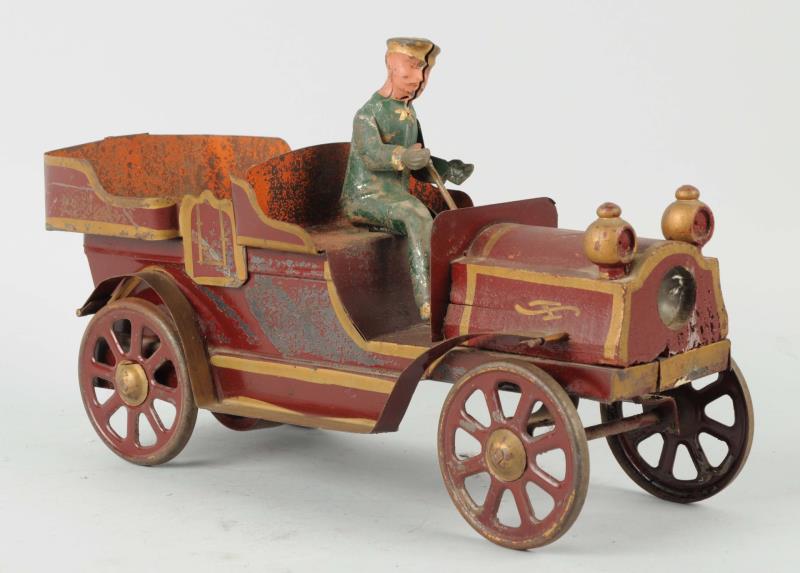 Appraisal: Early Pressed Steel Car This red car has an area