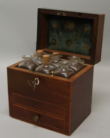 Appraisal: Walnut case with satin wood trim hinge lid fitted compartment