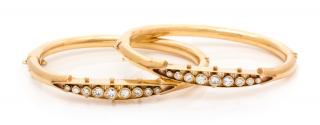 Appraisal: A Pair of Yellow Gold and Diamond Bangle Bracelets dwts