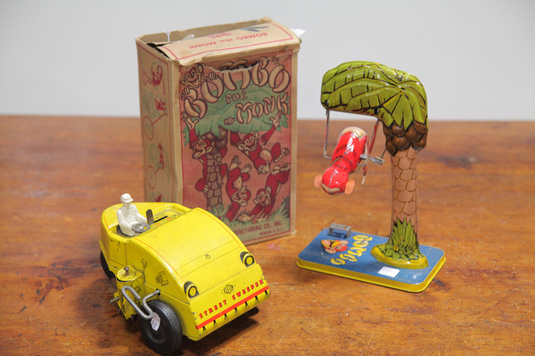 Appraisal: TWO TIN WIND-UP TOYS ONE WITH BOX American mid th