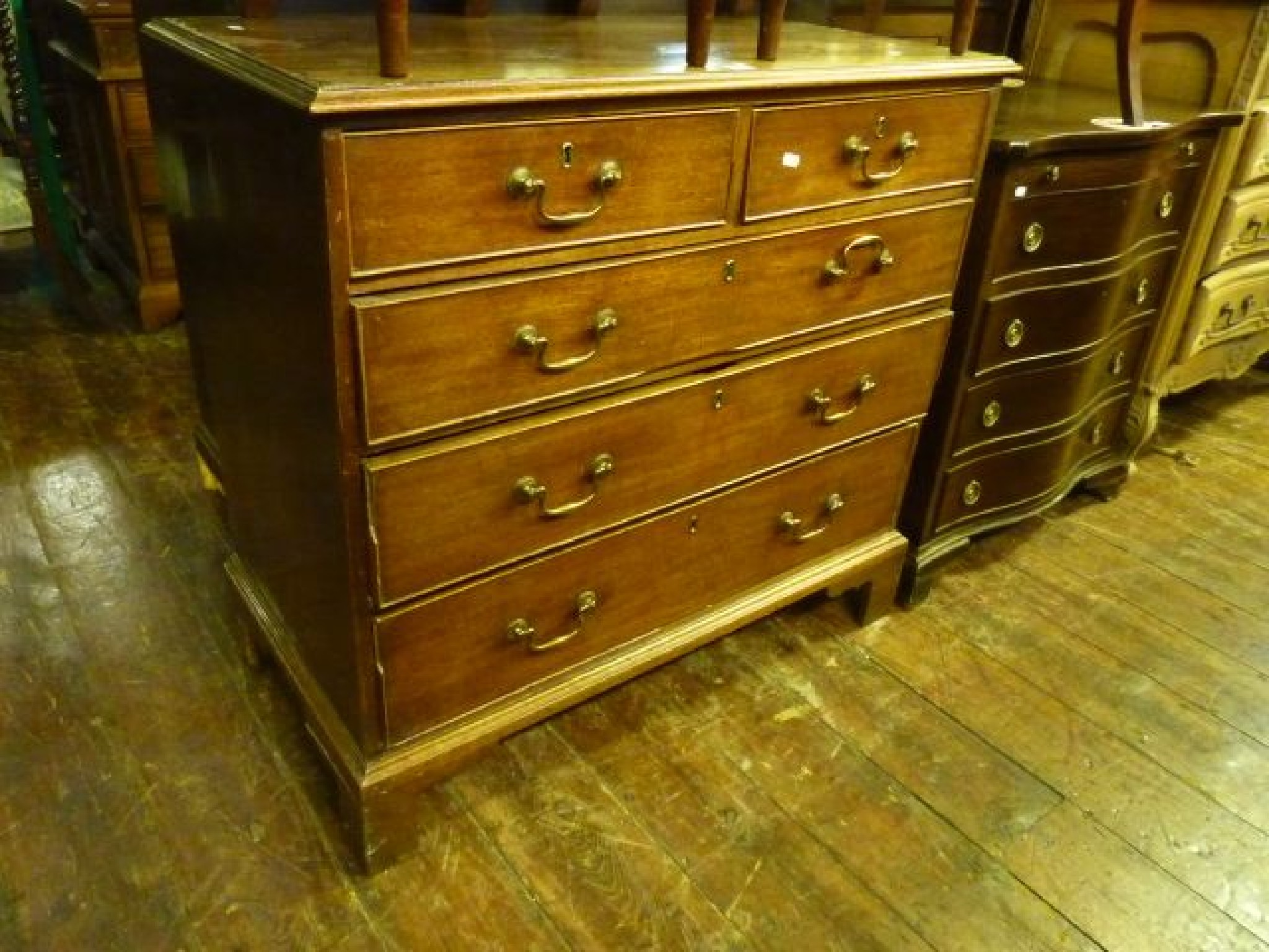 Appraisal: A Georgian mahogany chest of three long and two short