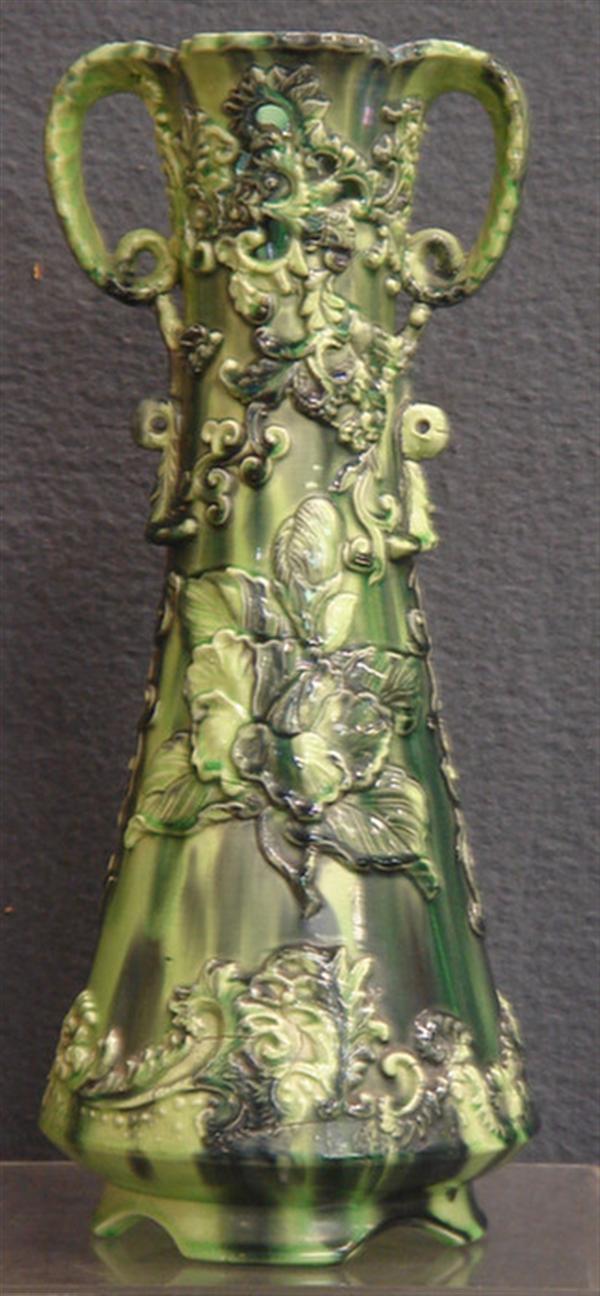 Appraisal: Green German majolica vase with floral relief design unmarked shrinkage