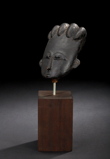 Appraisal: Asante Head Ghana the ovoid wood head with five parallel-ridged