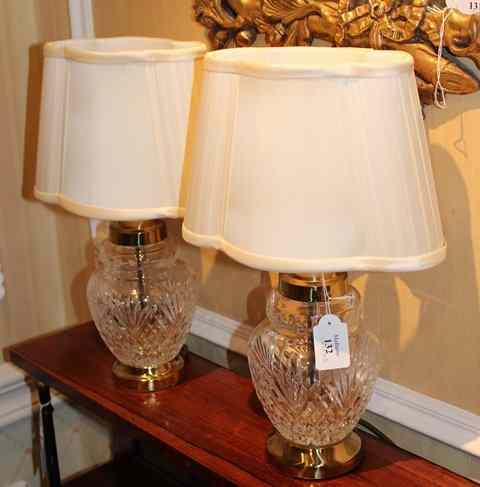 Appraisal: A PAIR OF BRASS MOUNTED CUT GLASS TABLE LAMPS the