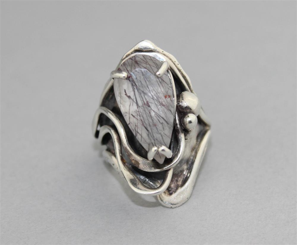 Appraisal: STERLING SILVER AND QUARTZ RING in a contemporary design with