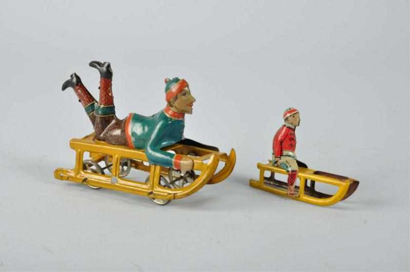 Appraisal: Lot of Tin Litho Sled Toys Description German Includes one