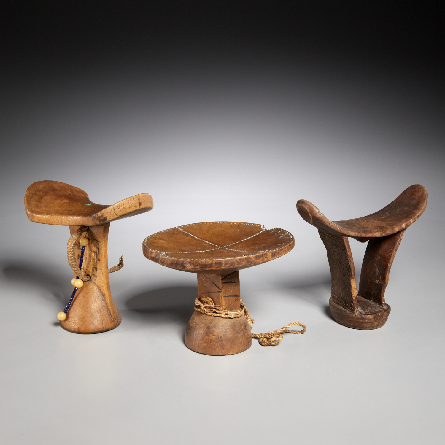 Appraisal: EAST AFRICAN STOOL AND NECKRESTS Possibly Kenya Somali or Ethiopia