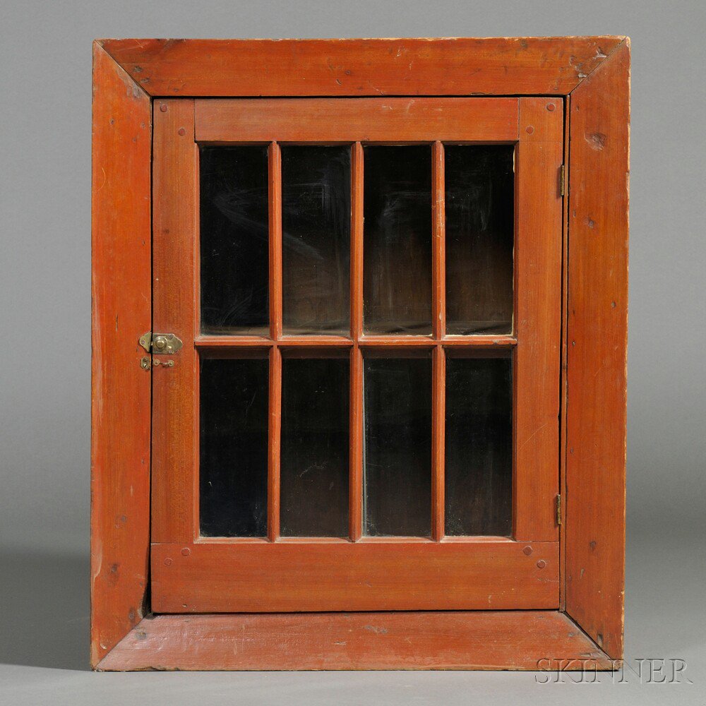 Appraisal: Red-painted Eight-light Hanging Cupboard New England early th century the