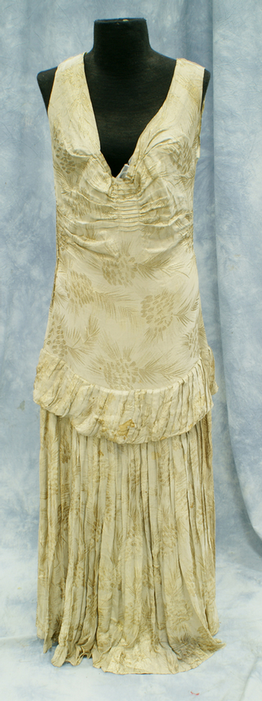 Appraisal: Sleeveless gold lame' shoulder gown early th c good condition