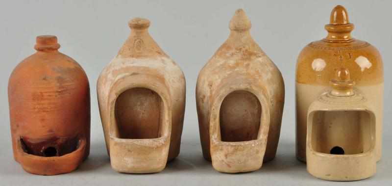 Appraisal: Lot of Small Pottery Chicken Feeders Description Four are glazed