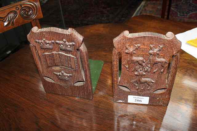 Appraisal: A PAIR OF JAMES ROGERS OF OXFORD HERALDIC BOOK ENDS