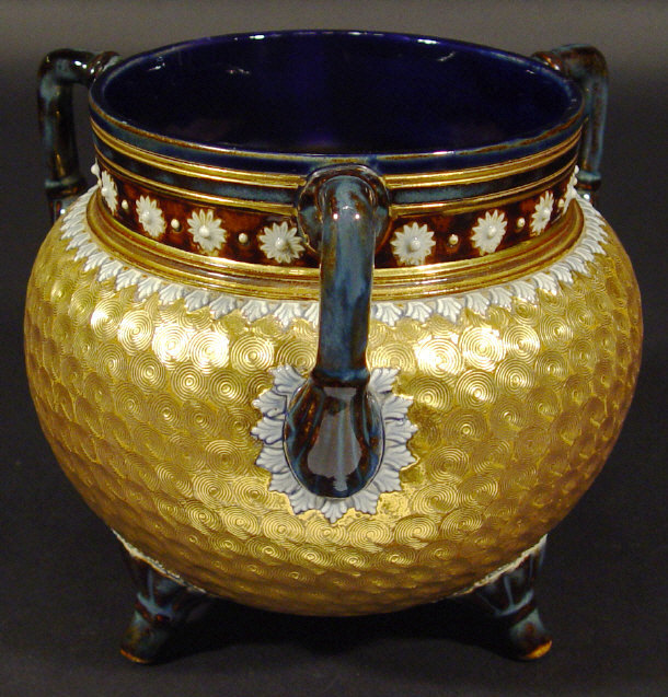 Appraisal: Doulton Lambeth stoneware three handled cauldron with relief moulded decoration