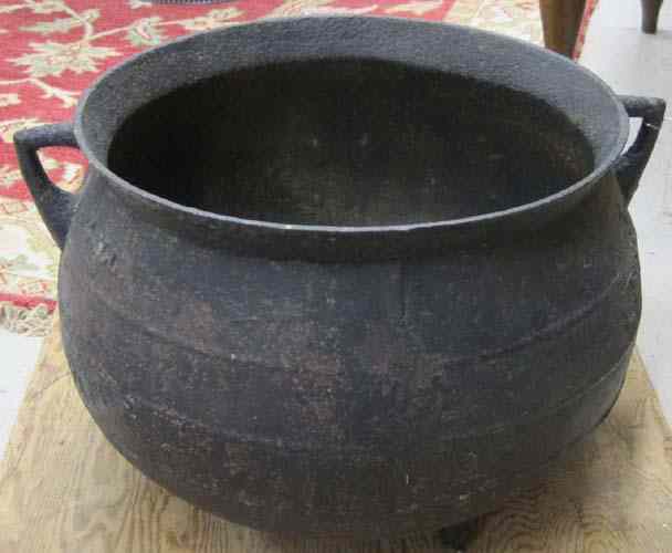 Appraisal: AMERICAN BLACK CAST IRON KETTLE of standard round cauldron form