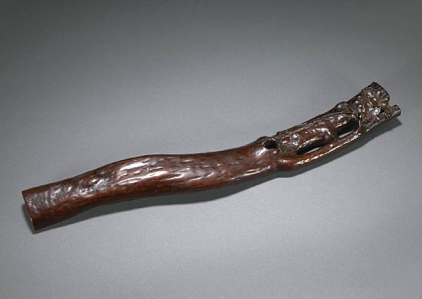 Appraisal: A burlwood wrist rest th Century Carved as the trunk