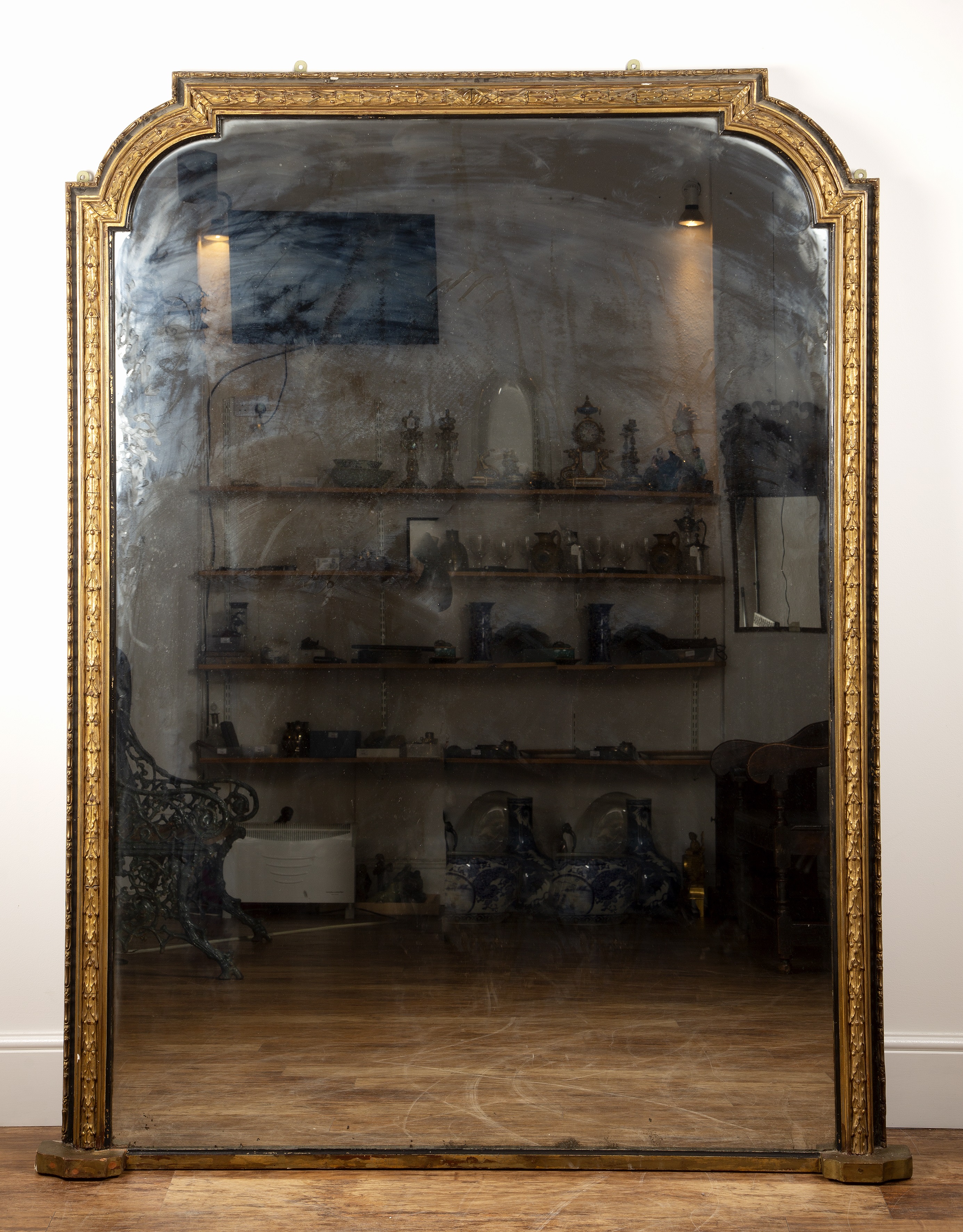 Appraisal: Very large gilt plaster and ebonised overmantel mirror th Century