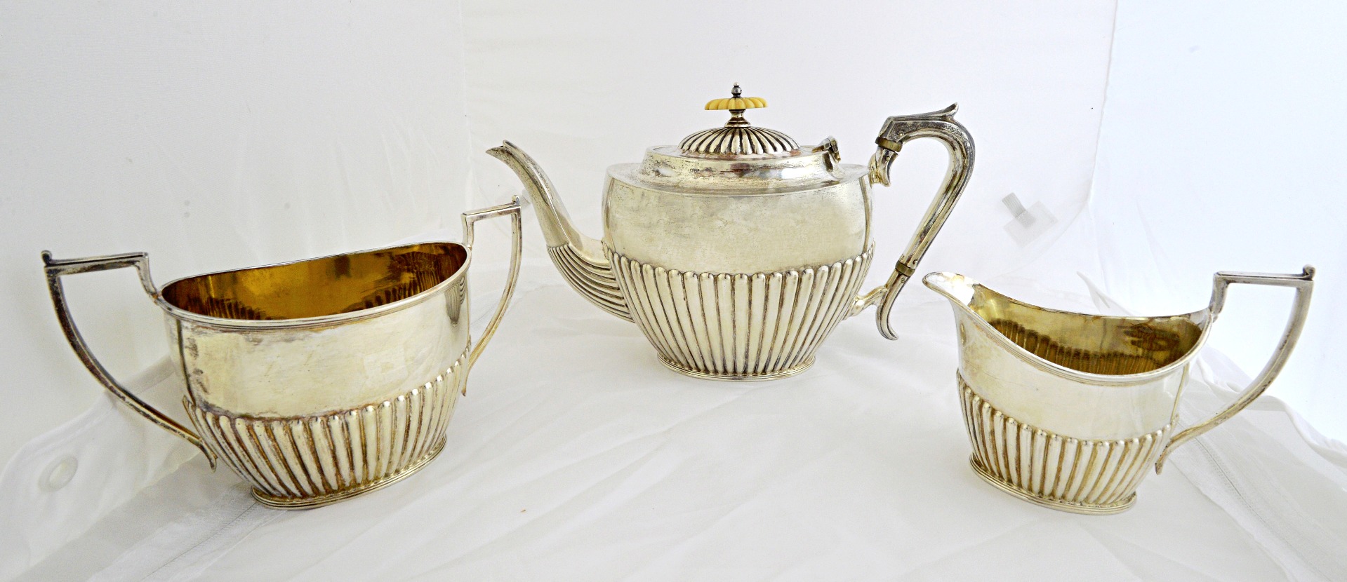 Appraisal: A silver three piece tea set comprising a teapot a