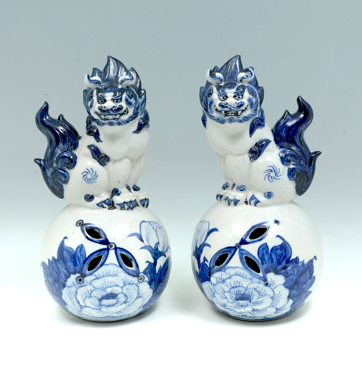 Appraisal: PAIR OF BLUE AND WHITE CHINESE PORCELAIN FOO DOGS Opposing