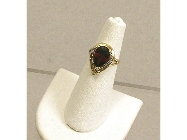 Appraisal: K yellow gold lady's large pear shape garnet and diamond