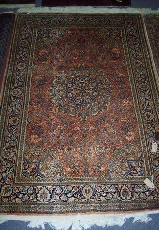 Appraisal: A modern part silk Persian rug with central indigo ground