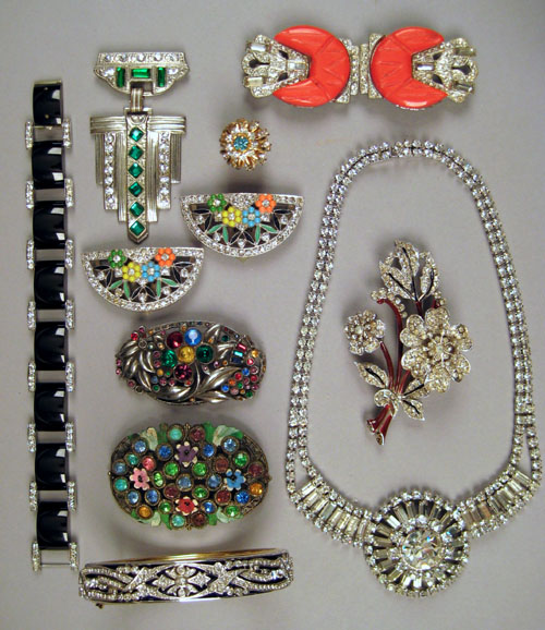 Appraisal: Floral spray rhinestone brooch together with a -color stone brooch