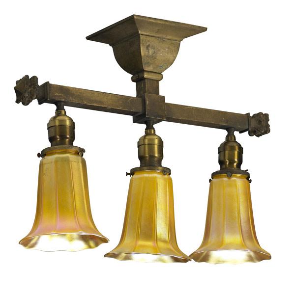 Appraisal: QUEZAL Three-light brass ceiling fixture with ribbed gold shades Each