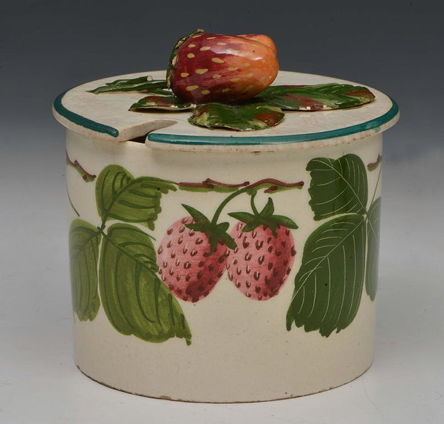 Appraisal: A JAM POT and cover probably Wemyss with applied strawberry