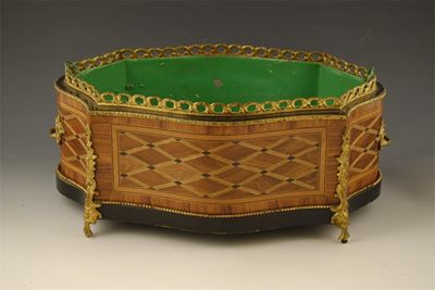 Appraisal: A French kingwood and parquetry jardiniere of serpentine oblong form