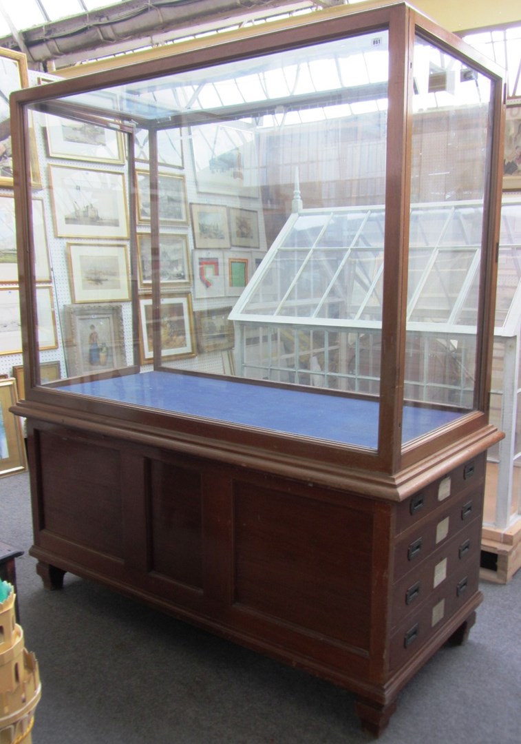 Appraisal: A th century rectangular mahogany framed shop display cabinet with