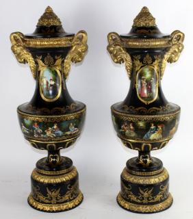 Appraisal: Pair of Venetian painted urns with ram's heads A pair