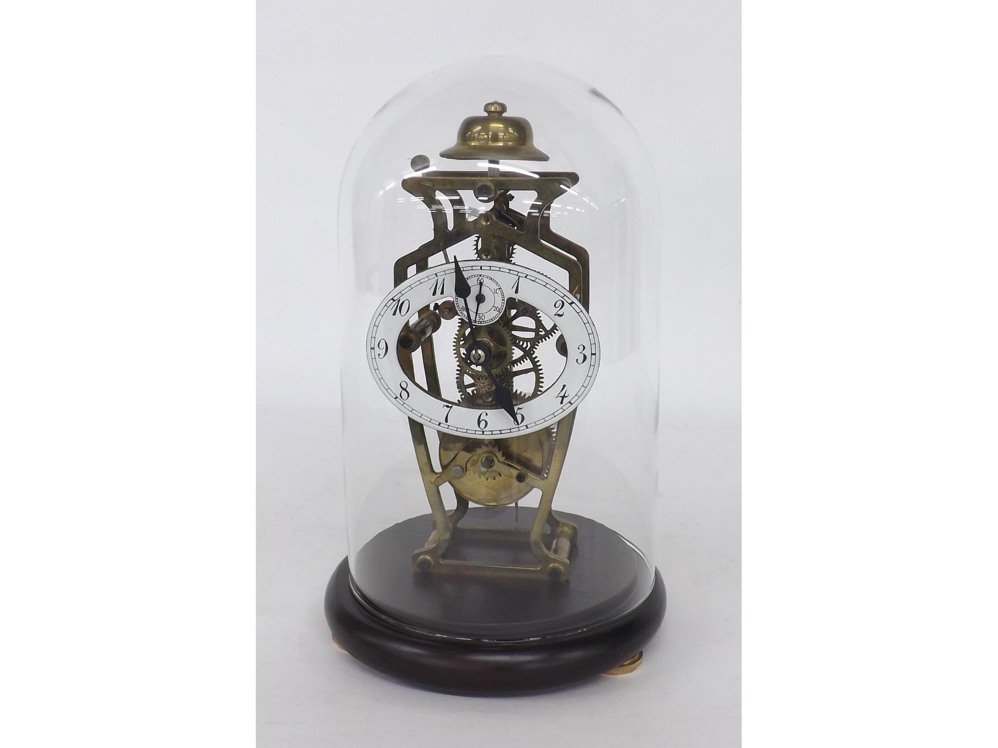 Appraisal: Small reproduction single train skeleton clock under a glass dome